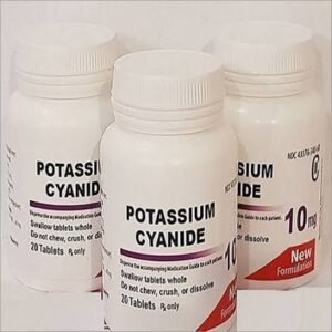 Hand holding potassium cyanide powder and tablets with UK and Europe flags in the background